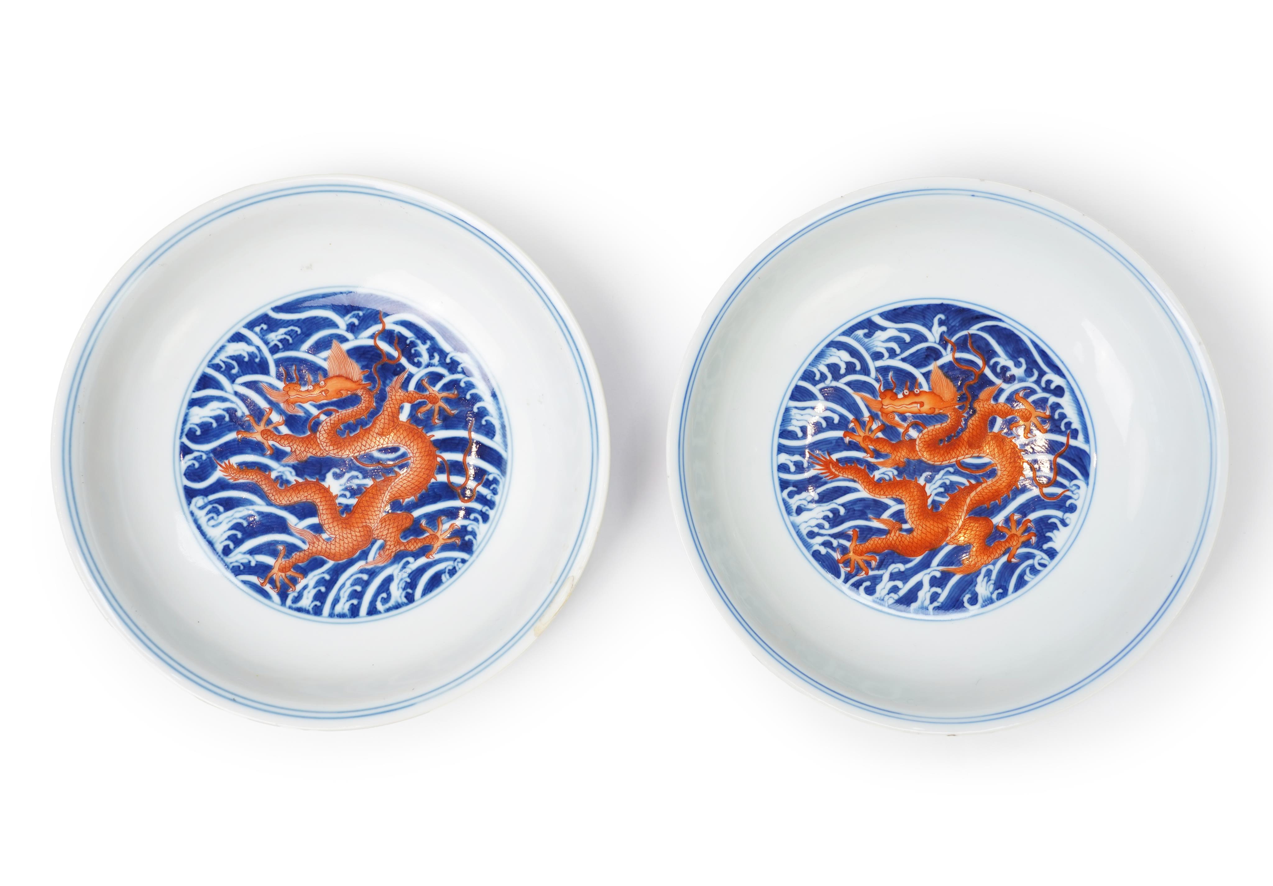 A pair of Chinese iron red and underglaze blue ‘dragon’ dishes, Qianlong seal mark and of the period (1736-95)